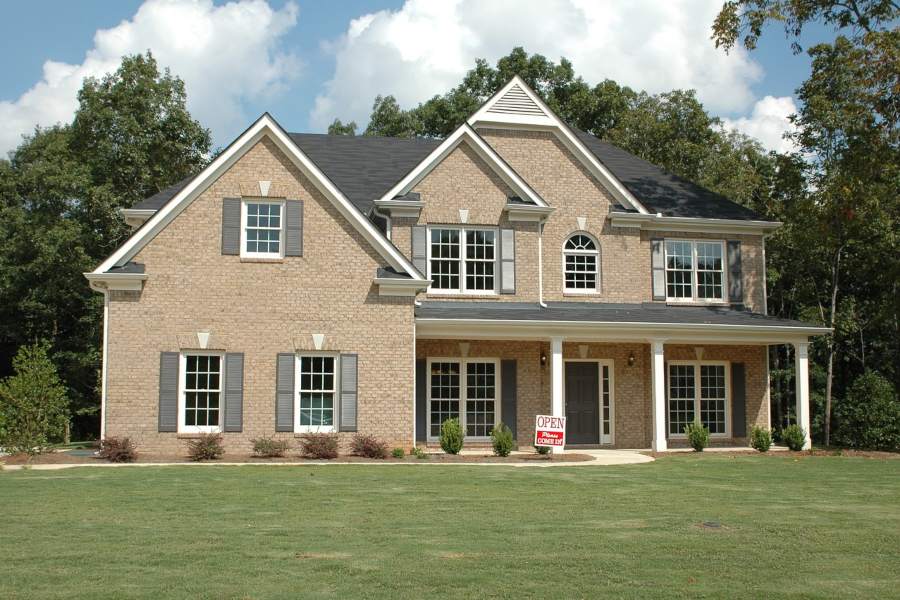 Two story homes for sale in Lockhart TX with open house sign in front