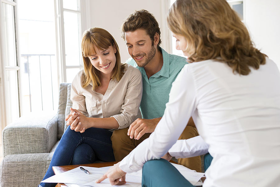 Lockhart TX Real Estate Agents talking with couple