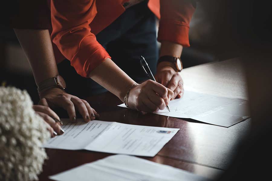 Real estate agent filling out important paperwork