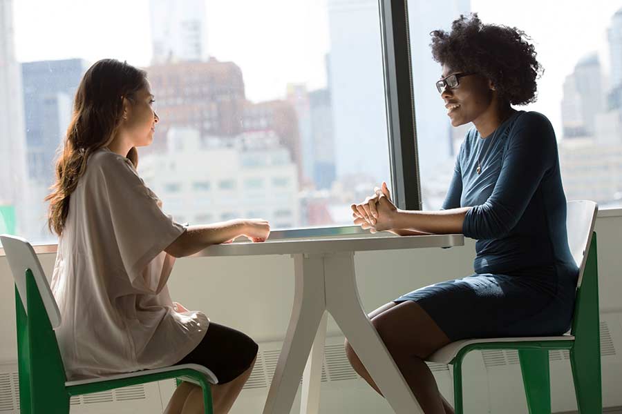 A homeowner meeting with a real estate agent to discuss a sale