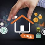 Illustration of a hand holding a house icon with a "sold" tag