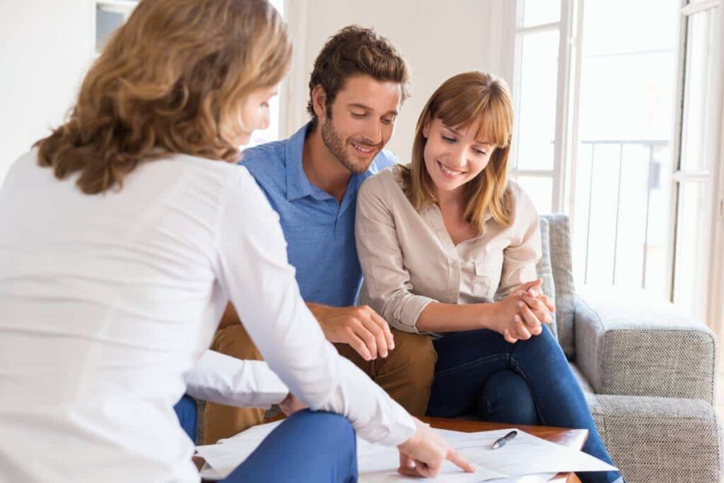 Experienced Bastrop realtor assisting a couple in finding their dream home from a list of homes for sale.