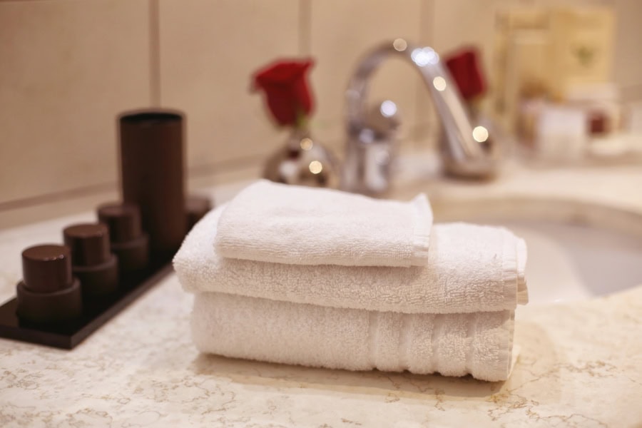 Elegant bathroom setup representative of quality rentals in Lockhart, featuring fresh towels and toiletries.