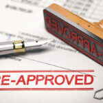 A document is stamped with the text "Pre-Approved"