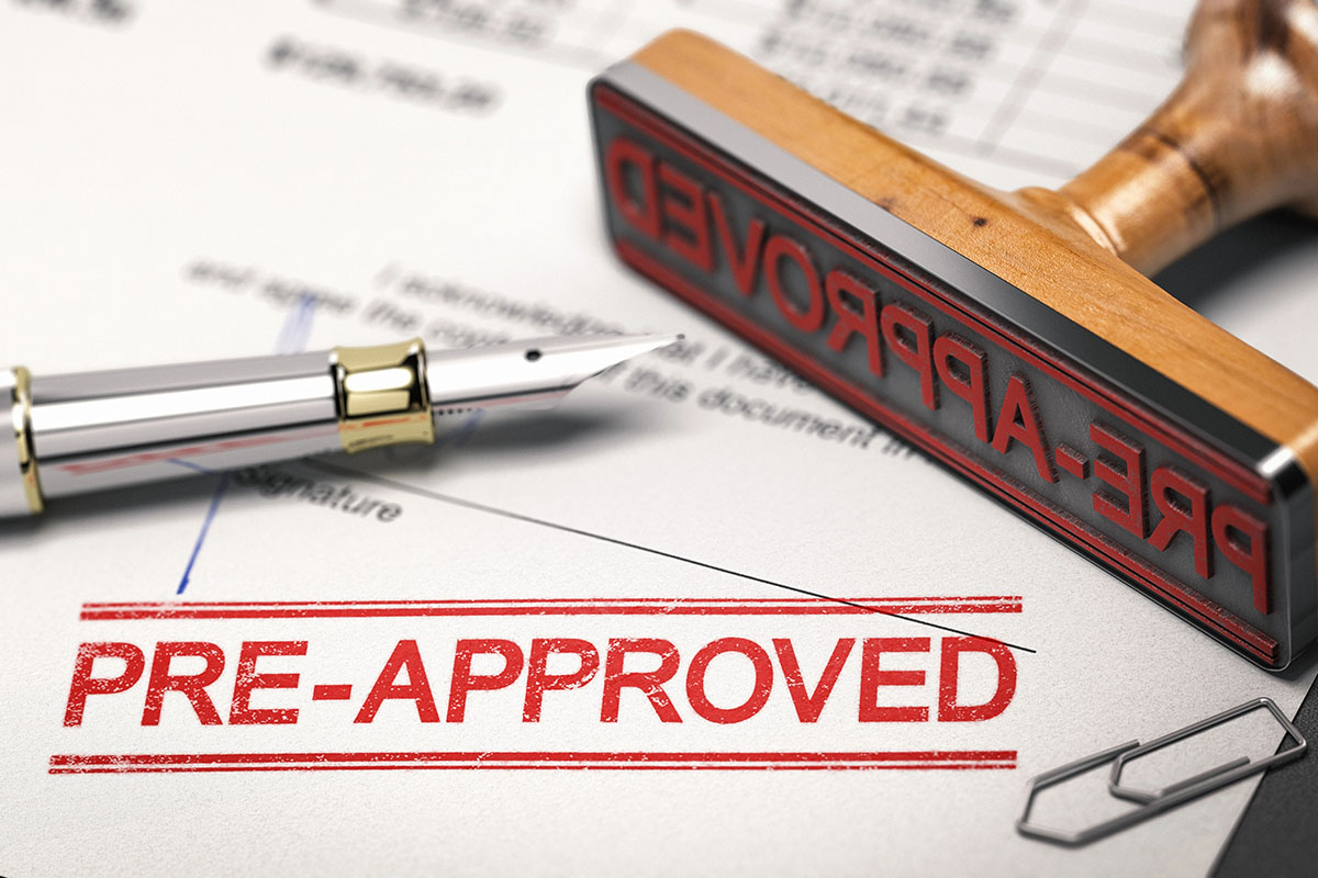 A document is stamped with the text "Pre-Approved"